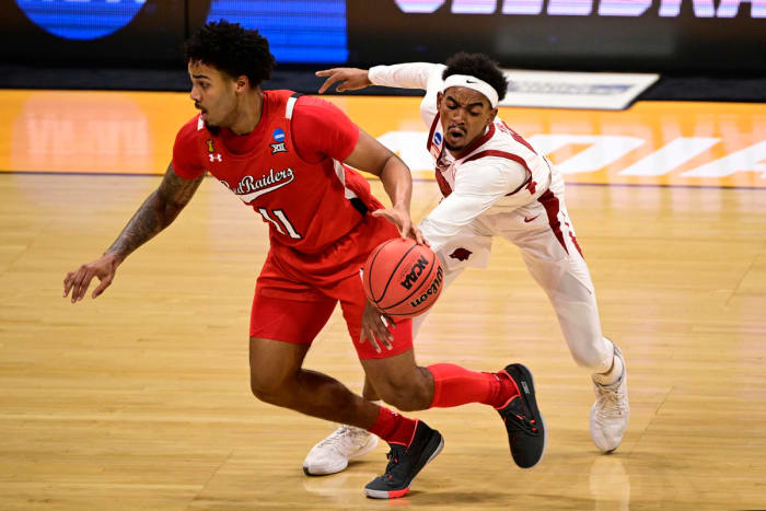 Arkansas Razorbacks guard Jalen Tate (11) defends against Texas Tech Red Raiders guard Kyler Edwards (11) in the first half in the second round of the 2021 NCAA Tournament at Hinkle Fieldhouse.